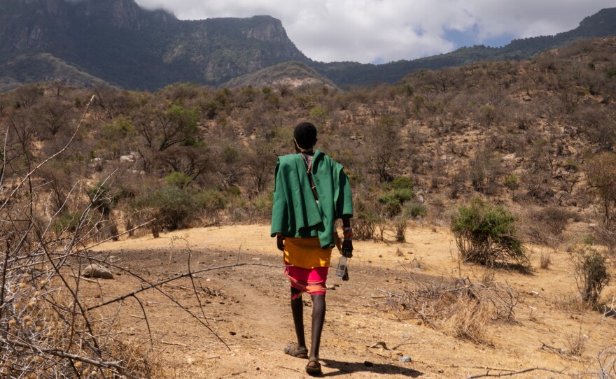 Ltesekwa Lekuuk, Paris's half-brother and a fellow moran, heads toward the mountain campsite where Paris had been living until a few weeks ago.