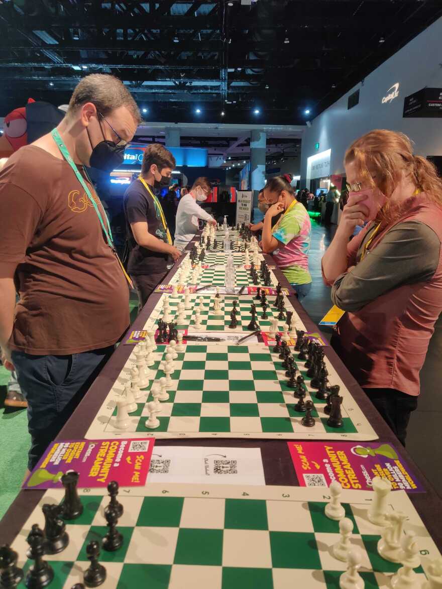 TwitchCon attendees stop at the Chess.com booth to play a quick game of chess — one of the top categories on Twitch, Oct. 9, 2022.