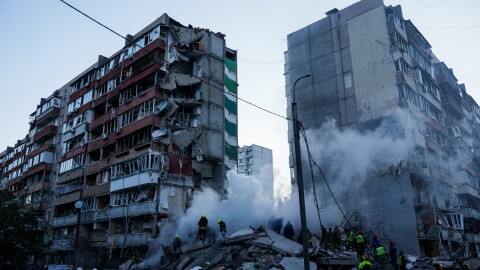 Rescue workers clear the rubble of a house heavily damaged after a Russian strike on a residential neighborhood in Kyiv, Ukraine, on Thursday, May 14, 2026.
