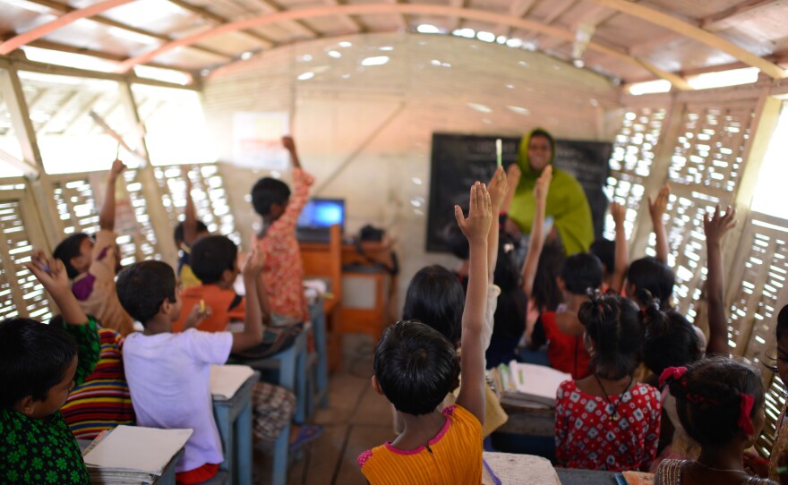 The boat has one classroom that holds about 30 kids. The walls are made of reeds. The lone computer runs off solar panels.