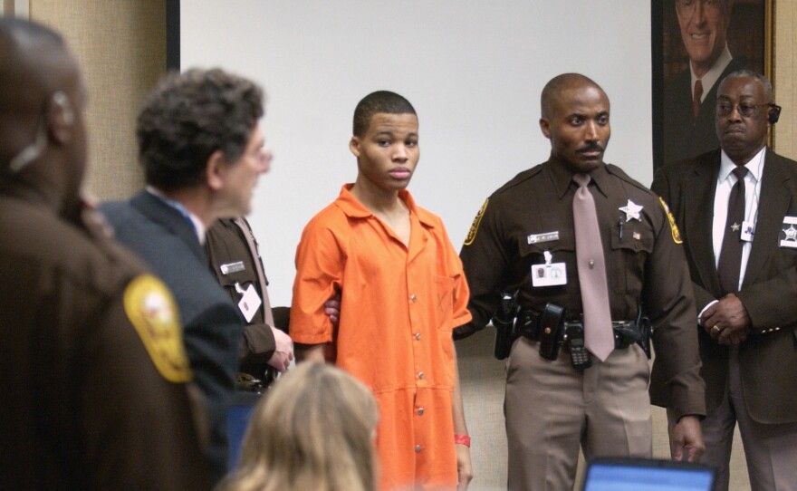 Lee Boyd Malvo (center) enters a courtroom in Virginia Beach, Va., in 2003. Some 15 years later, at the age of 33, Malvo has been granted another sentencing hearing.