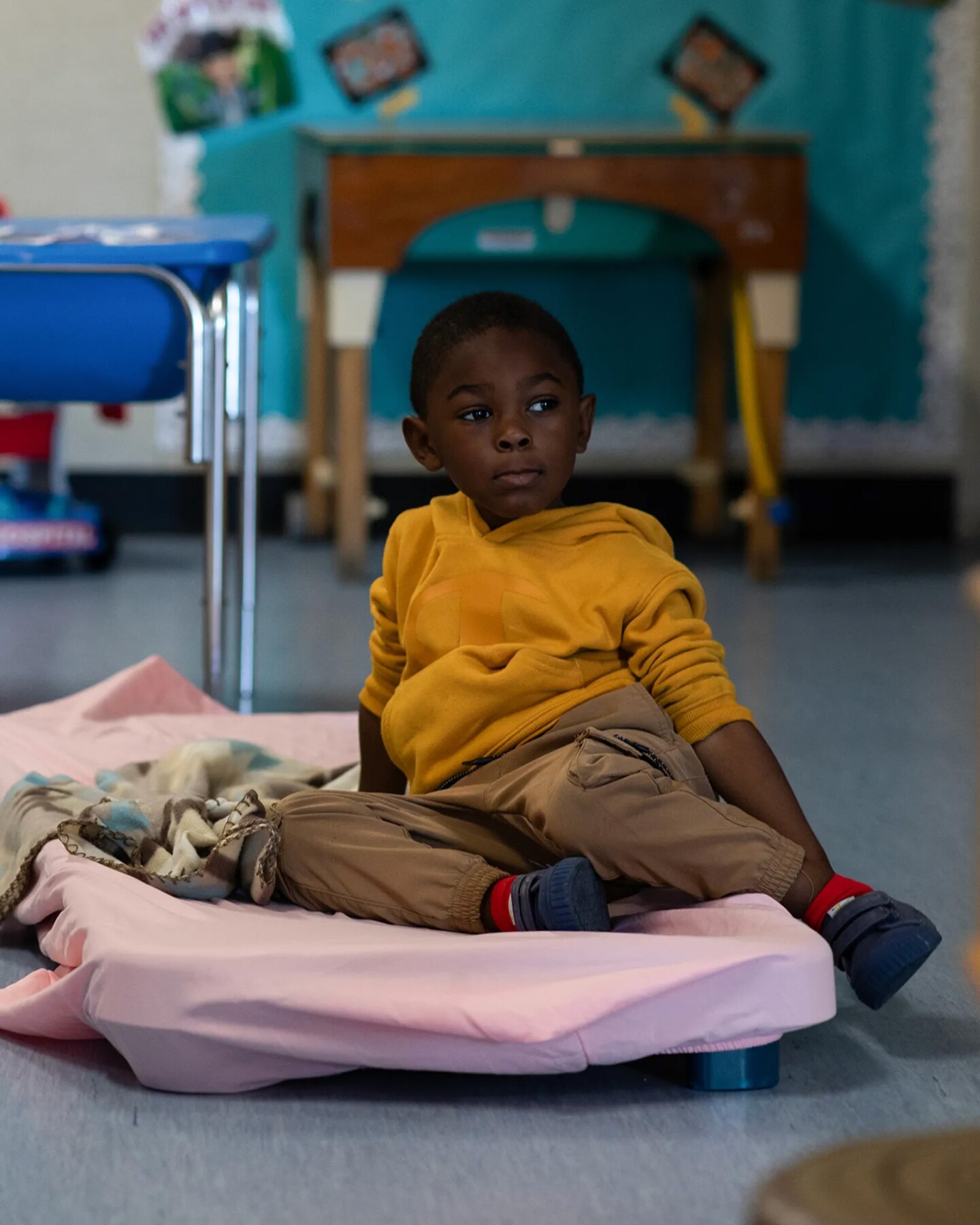 A student looks off into the distance during nap time at Mi Escuelita on May 5, 2025.