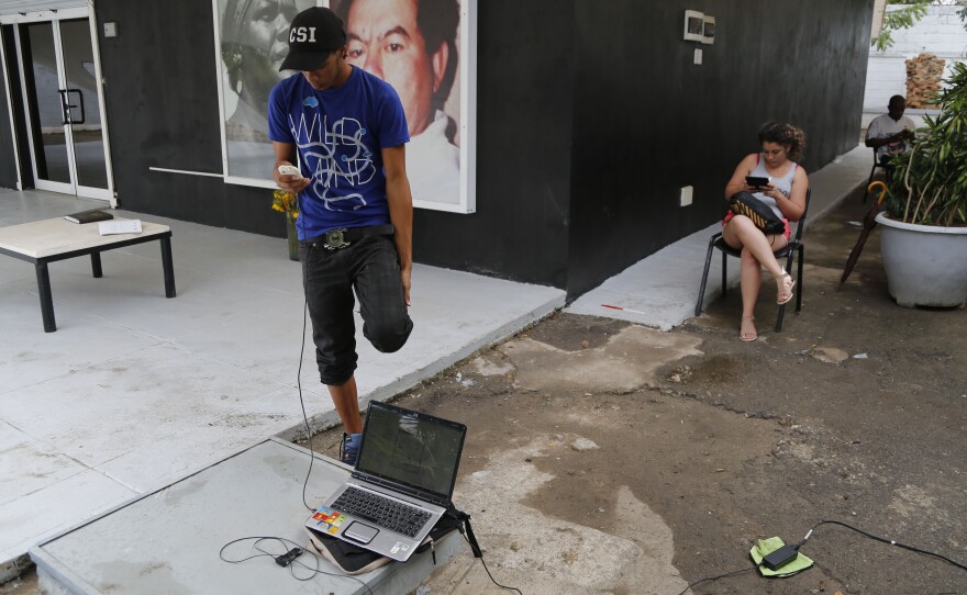 People use a free Wi-Fi network at a center run by artist Kcho, in Havana, Cuba, on March 11, 2015. It's a small but unprecedented loosening by the government of Cuba's strict Internet regulations. Still, the vast majority of Cubans do not have Internet access.