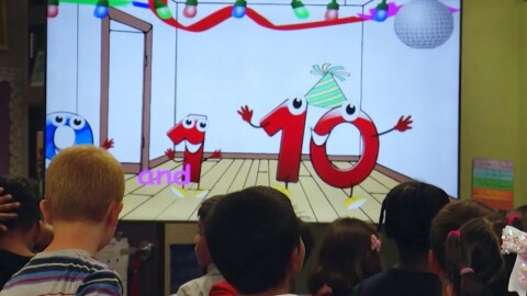 First grade students at Del Rio STEM Academy watch an educational math video in this undated photo. 