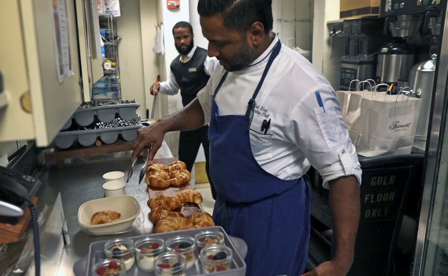 Chef Zaid Khan prepares food in Boston to be sold through the app Too Good To Go. The app helps establishments sell food that would otherwise go to waste.