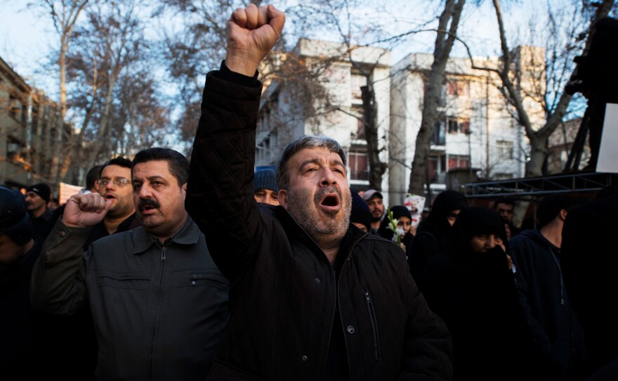 A man shouts during the funeral procession Monday in Iran's capital city.