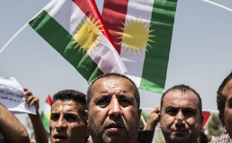 Iraqi Kurds call for independence as Masud Barzani, president of Iraq's autonomous Kurdistan region, arrives to attend a session of the Kurdish parliament on July 3.