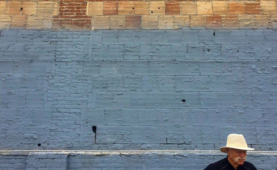 Geologist and SDSU Professor Emeritus Pat Abbott inspects the facade of the historic Spreckel's building on Broadway in downtown San Diego on May 23, 2018.