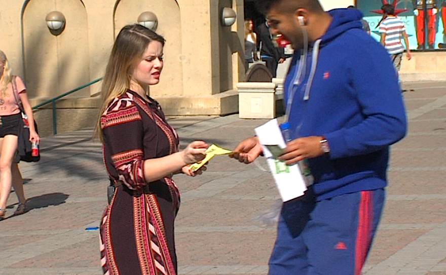 Campus coordinator Brittnie Bloom hands out information about Covered California at SDSU on November 20, 2014.