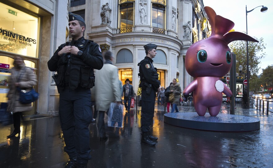 French gendarmes patrol outside the Printemps department store in Paris, a city that's still on edge and on a security alert after last week's deadly terrorist attack.