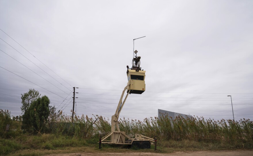 A surveillance tower is seen in Fred Cavazos' property yards away from the Rio Grande and the privately funded border wall in Mission, Texas.
