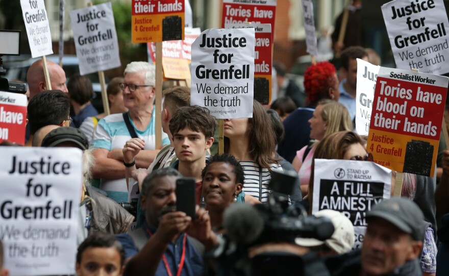 Londoners protest outside a Kensington Council meeting to discuss Grenfell Tower on July 19. British police say there are grounds to suspect the council and other local authorities of committing corporate manslaughter in the fire that killed at least 80 people.