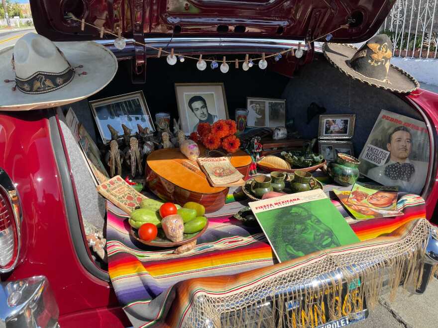 Manuel Navarro, president of the Por Siempre Car Club, displays ofrenda in the back of his car in Oceanside, Calif. Oct. 22, 2021.