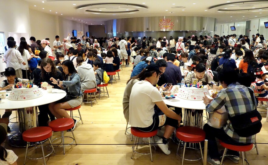 Crowds fill the Cup Noodles Museum in Yokohama, Japan, to decorate their own branded cups before creating personal noodle flavor blends.