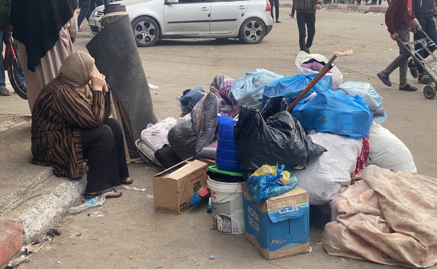 An evacuated woman with belongings in Rafah, in the southern Gaza Strip, on Tuesday.