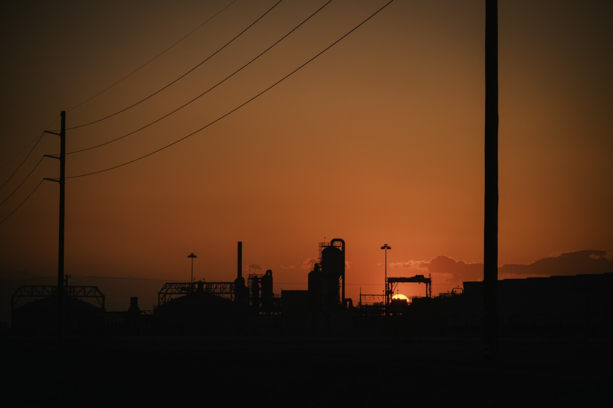 The sun sets behind a geothermal facility near Calipatria, California in Imperial County on April 26, 2024.
