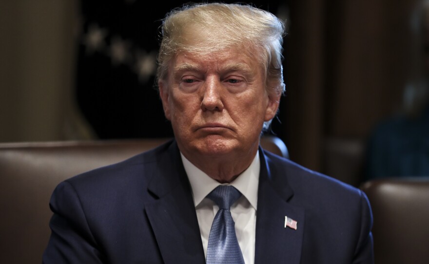 U.S. President Donald Trump listens during a meeting in the Cabinet Room of the White House in Washington, D.C., U.S., on Tuesday, July 16, 2019.