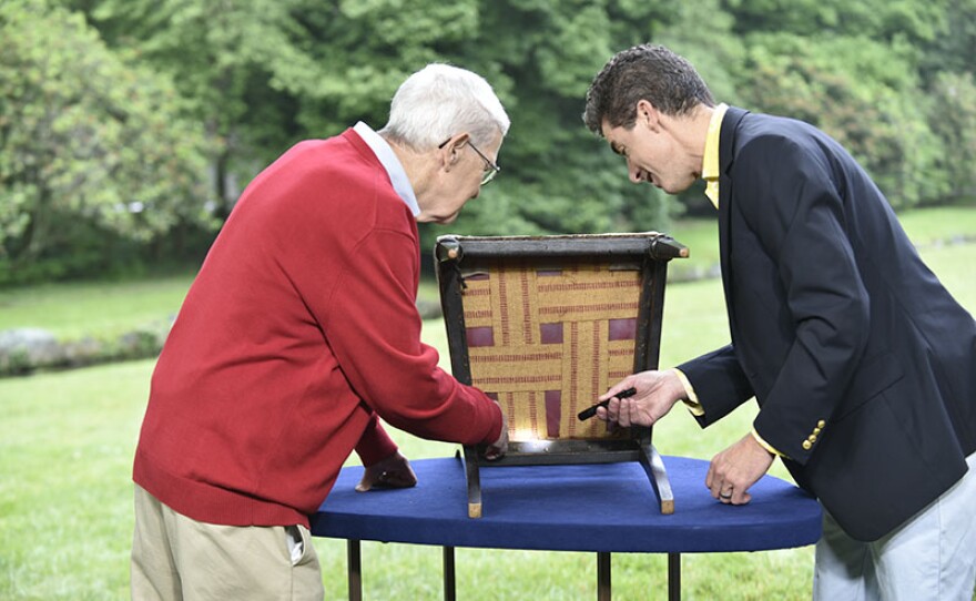 Andrew Brunk (right) appraises a Herter Brothers aesthetic movement chair, ca. 1875 at Winterthur Museum, Garden & Library.