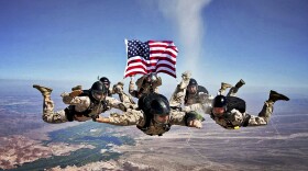 Marines release the ashes of Marine Corps Sgt. Brett Jaffe above Phillips Drop Zone on Yuma Proving Grounds, Arizona 