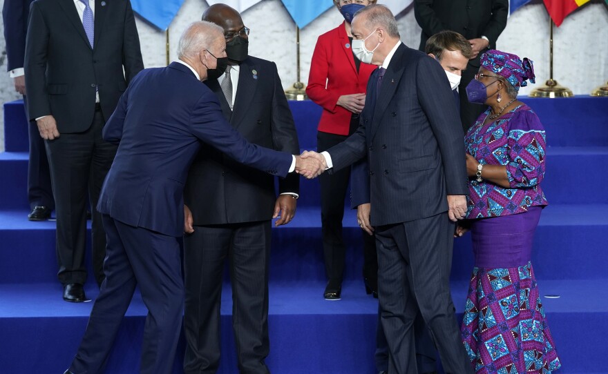 President Biden greets Turkey's President Recep Tayyip Erdogan during a group photo at the G-20 summit.