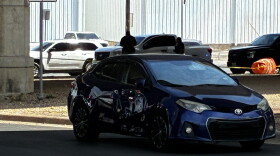 Bullet holes can be seen in a car in Austin, Texas, on Sunday.
