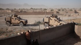 U.S. soldiers enter a compound for a security meeting in Shah Joy District, Zabul Province, Afghanistan in the fall of 2010.