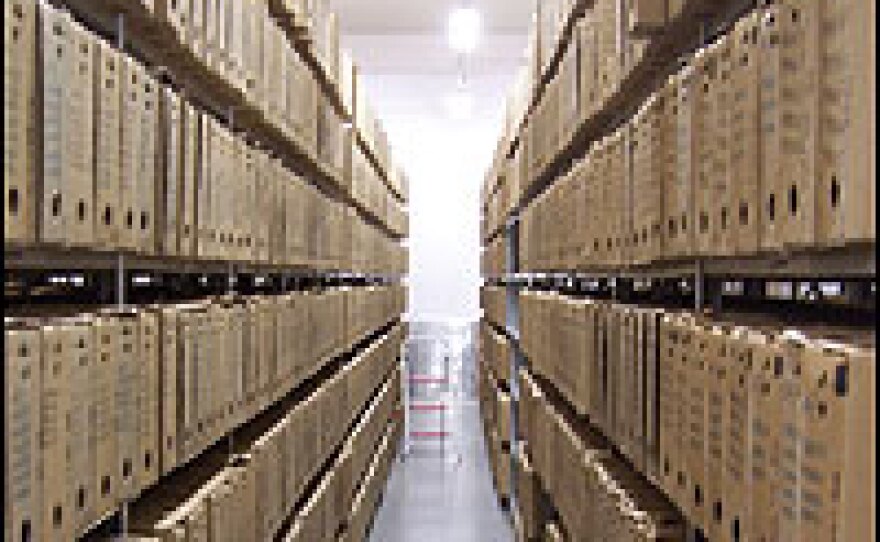 Boxed and numbered, files from Poland's Nazi occupation and communist era are kept underground in a modern archive in Warsaw.