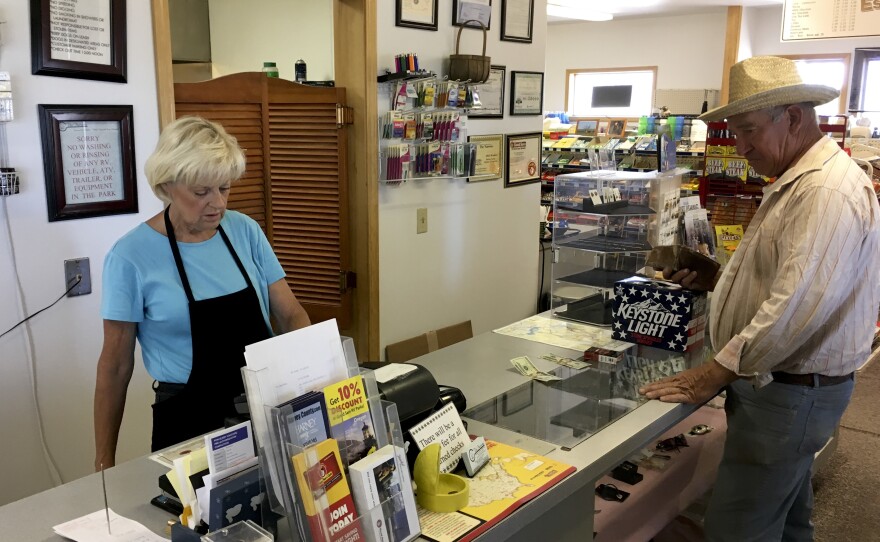 Linda Gainer, owner of the Narrows Café and RV Park near the Malheur National Wildlife Refuge, attends to a customer in June. She hopes the visitor center at Malheur reopens soon, for both the tourists' sake as well as the community.