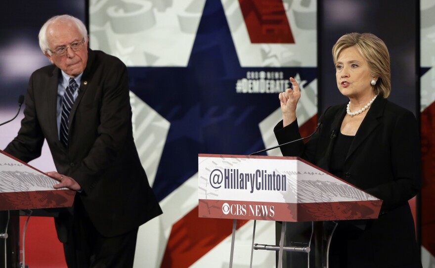 Hillary Rodham Clinton makes a point as Bernie Sanders listens during a Democratic presidential primary debate on Saturday in Des Moines, Iowa.