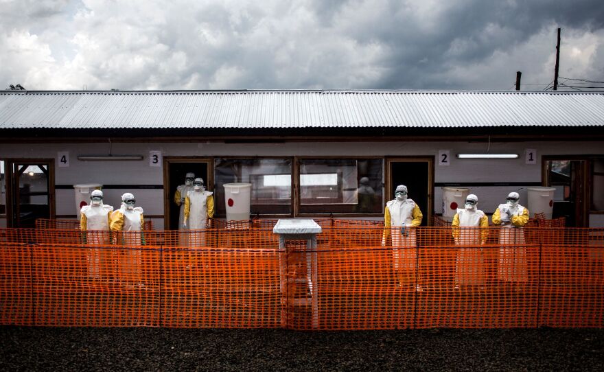 Health workers gather outside a newly built treatment center earlier this month in Bunia, Democratic Republic of the Congo.