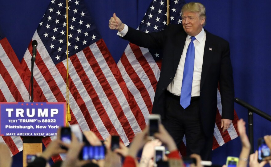 Republican presidential candidate Donald Trump gives thumbs-up to the crowd as he arrives to a campaign rally last week in Plattsburgh, N.Y.