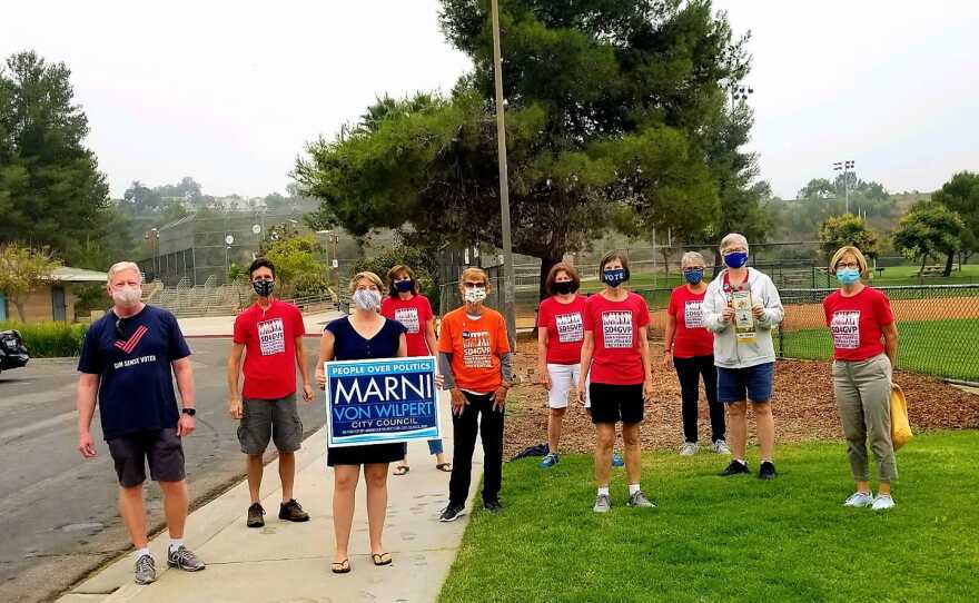 San Diego City Council candidate Marni Von Wilpert stands with supporters in this undated photo.