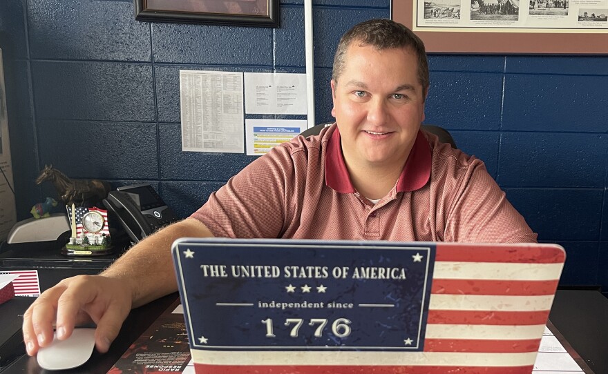 Mike Thomas, the We the People teacher at Sheridan High School in Sheridan, Wyo., smiled from behind his patriotically decorated laptop. (Sheridan, Wyoming)