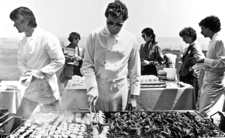 Jeremiah Tower <a href="http://www.csmonitor.com/1983/0518/051807.html">grills lunch</a> for 100 food journalists on the lawn of the Astor mansion in Newport Beach, R.I., in 1983. Tower wowed the East Coasters with his "new California" or new American cooking.