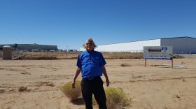 Adelanto City Councilman Johnny Bug Woodard Jr. points to a warehouse in the city's Green Zone that could be used for medical marijuana cultivation.