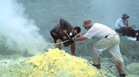 San Diego researcher David Hilton gathers samples from a hot air vent in Indonesia in this undated photo.