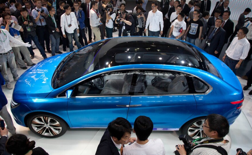 China is now the world's largest market for cars, and the Auto China 2012 car show is now taking place in Beijing. Here, the Denza electric car, a joint creation by Daimler and Chinese manufacturer BYD, is unveiled Monday.