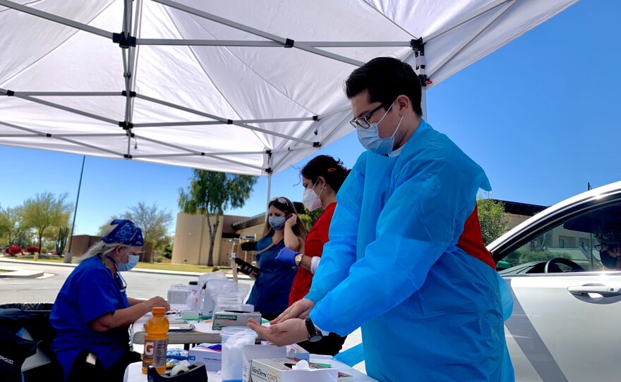Staff from the Imperial County Public Health Department and partnering agencies hold a drive-through clinic to give residents 65 and older their second dose of the COVID-19 vaccine on March 5, 2021.