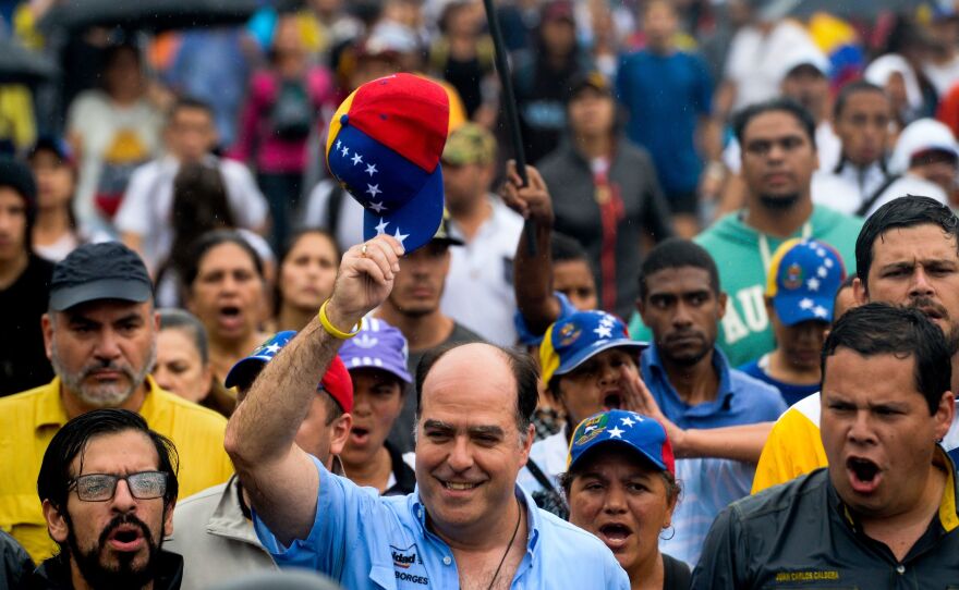 Julio Borges, president of Venezuela's National Assembly, acknowledges the crowd during a rally against Maduro on Thursday.