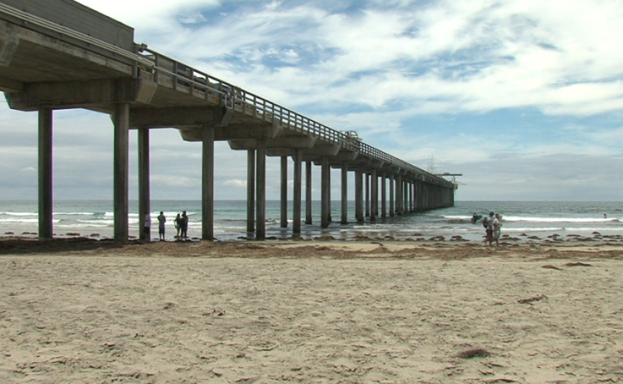 The Scripps Pier juts out over La Jolla Shores, which could be partially underwater by the end of the century according to sea level rise projections, Aug. 24, 2015.
