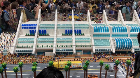 The San Diego Comic-Con International Convention diorama spans multiple tables. Attendees gather around the construction and take photos of the LEGO masterpiece on July 23, 2025.