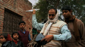Customers of the social enterprise D.light Design in India test its solar-powered LED light.