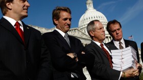 (L-R) Rep. John Fleming (R-LA), Rep. Jeff Flake (R-AZ), Rep. Joe Wilson (R-SC), holding a copy of H.R. 3962 and Rep. Phil Gingrey (R-GA) announce an ammendment to the House version of health reform legislation outside the U.S. Capitol November 4, 2009 in Washington, DC. The ammendment to the 'Affordable Health Care for America Act' would automatically enroll all members of Congress in the 'public option'. 