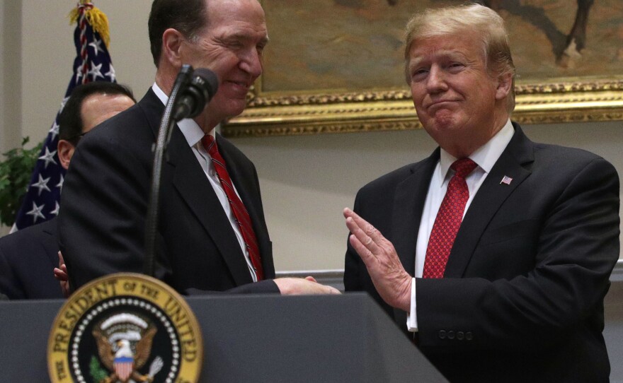 Former President Donald Trump shakes hands David Malpass on Feb. 6, 2019 after nominating him to lead the World Bank.