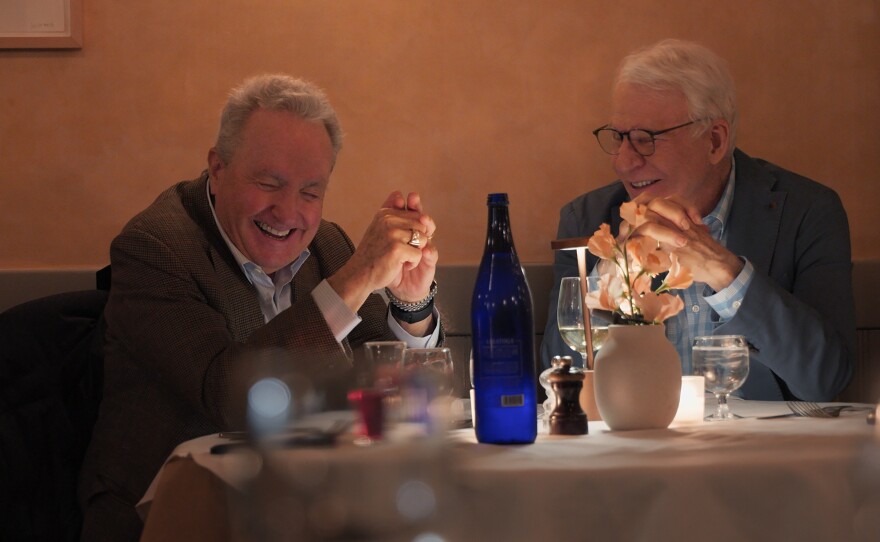 Lorne Michaels, left, and Steve Martin share a laugh in a scene from Lorne. Martin is among several well-known comedians who reflect on Michaels in the documentary.