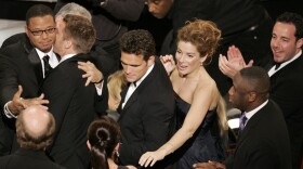 The cast of <em>Crash</em> celebrates after its surprise upset of <em>Brokeback Mountain</em> for best picture, at the 78th Academy Awards in 2006.