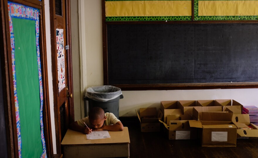 Third-grader Kassim West last July at Walter G. Smith Elementary School, one of more than 20 Philadelphia public schools that closed at the end of the school year.
