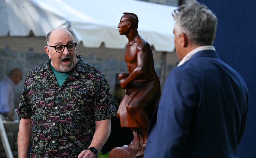 Tony Abeyta (right) appraises a 1958 Dick West Coyote-Warrior sculpture, in Baltimore, Md. ANTIQUES ROADSHOW “Maryland Zoo, Hour 1” airs Monday, April 14 at 8/7C PM on PBS.