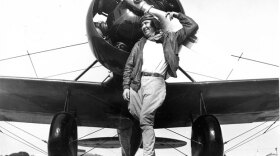 Pancho Barnes poses with her Travelair Mystery Ship circa 1930. Only five of these radical racing planes were built. Pancho flew hers to glory, breaking Amelia Earhart's woman's air speed record in the skies over Van Nuys airport. Photo property of the Pancho Barnes Trust Estate Archive. 

