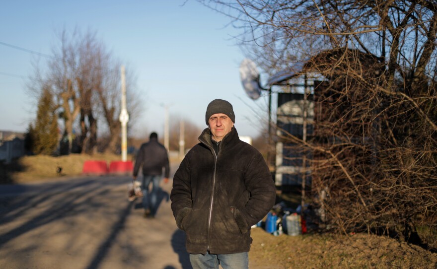 Petro Maruhniak volunteers at a checkpoint, like many others, in 6-hour shifts.